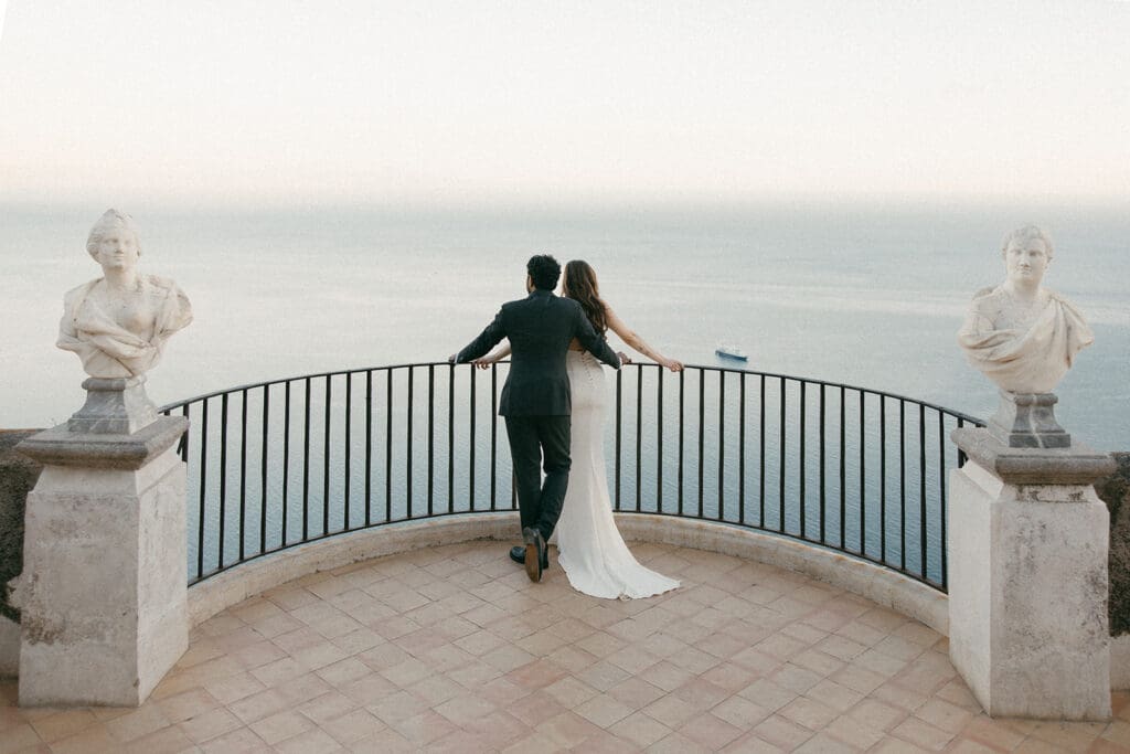 couple walking in a European setting while planning their wedding location
