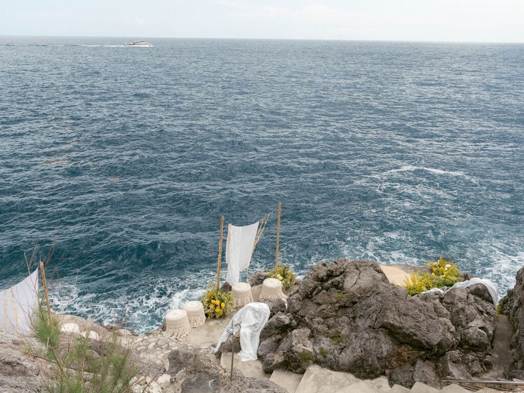 Coastal destination wedding ceremony overlooking the Amalfi Coast in Italy.