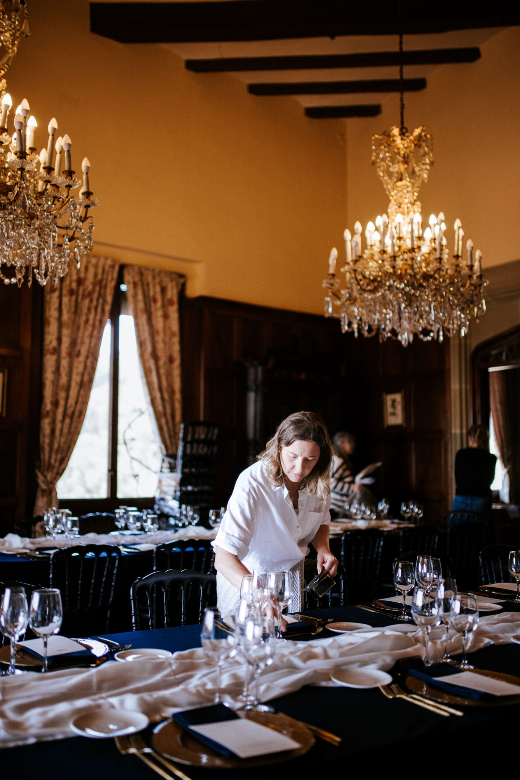 Destination Wedding planner setting up a reception table