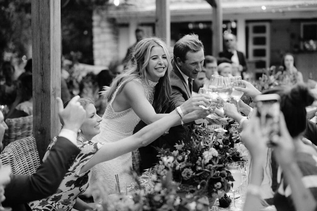 Couple celebrating with family and friends during an intimate destination wedding in Europe.